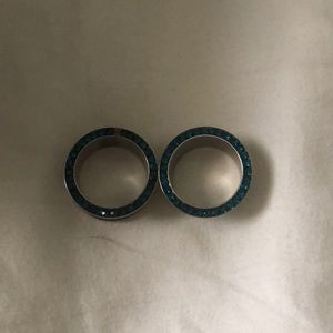 Never worn. Swarovski Gem (blue zircon) tunnels.